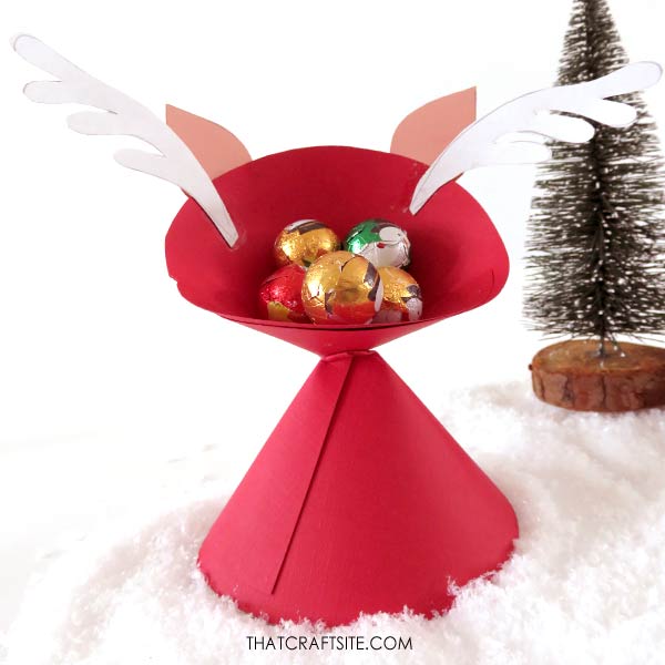 Paper reindeer from the back showing christmas treats inside head space.