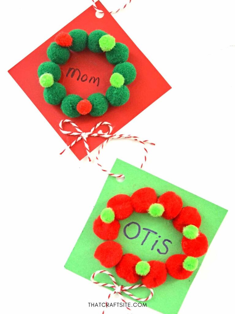 Red and green mini pompom wreath gift tags for Mom and Otis.