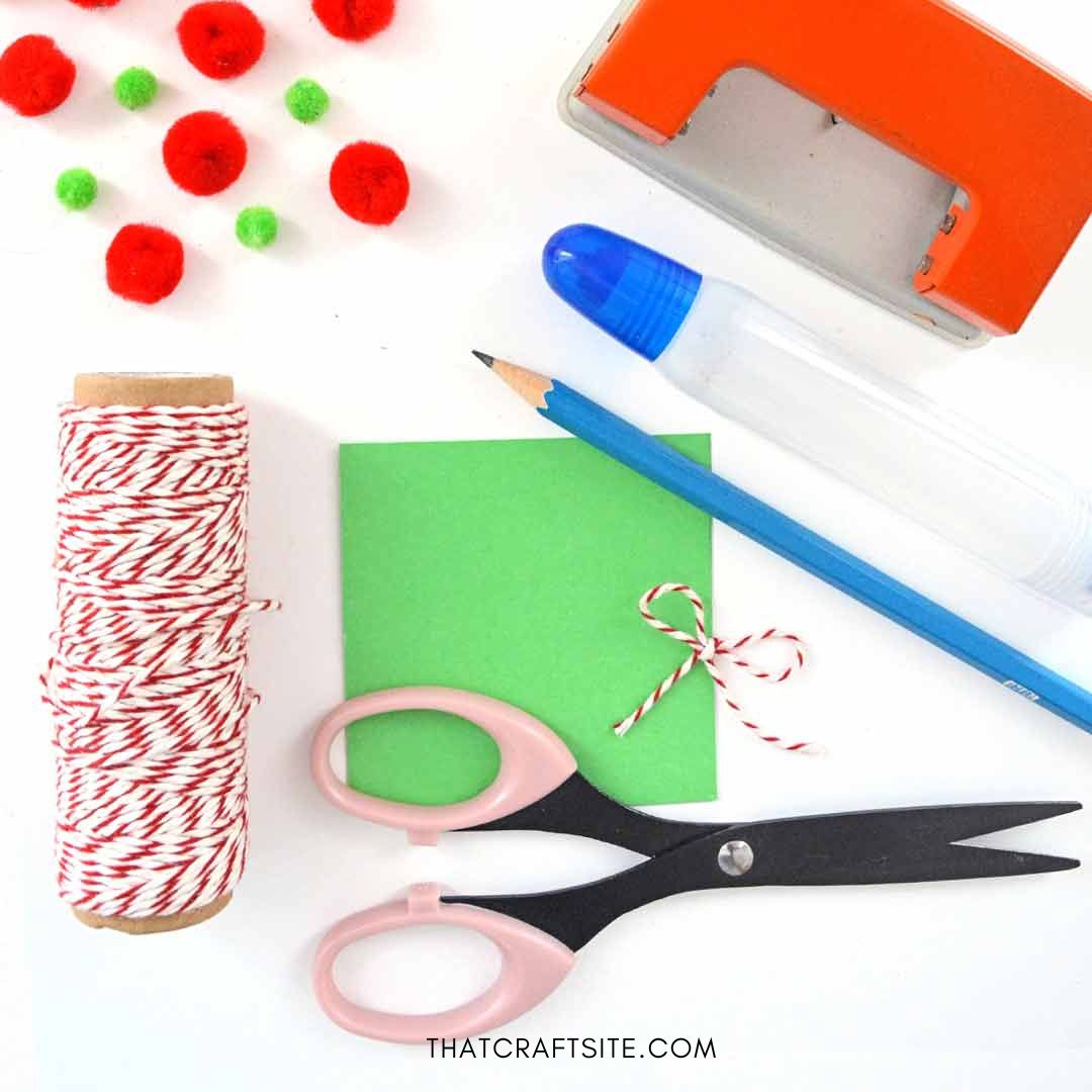 DIY mini pom pom wreath gift tag. Step 1: Gather tools and materials. thatcraftsite.com.
