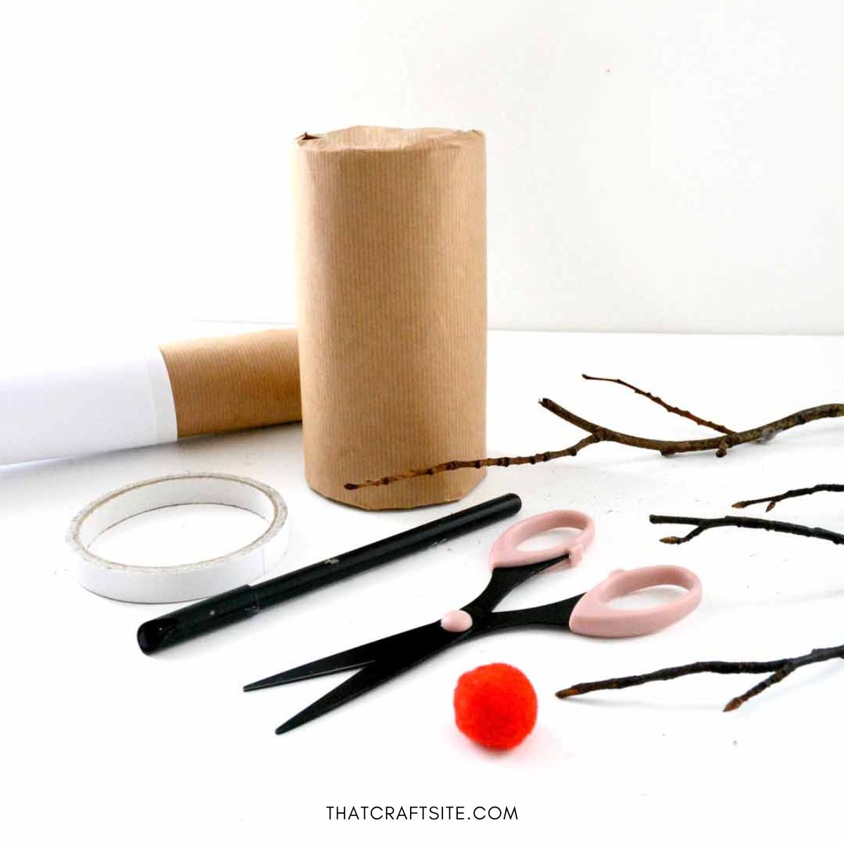 DIY Cylinder Christmas Reindeer Gift Wrap. Step 1: Wrap your gift in brown kraft paper and gather materials.