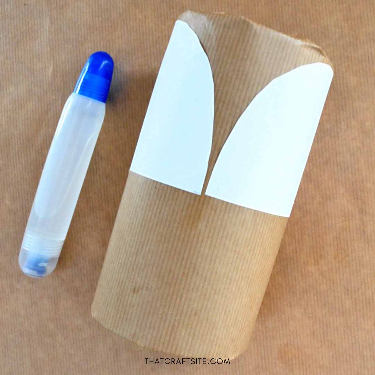 DIY Cylinder Christmas Reindeer Gift Wrap. Step 3: Glue white paper strip on top half of cylinder.