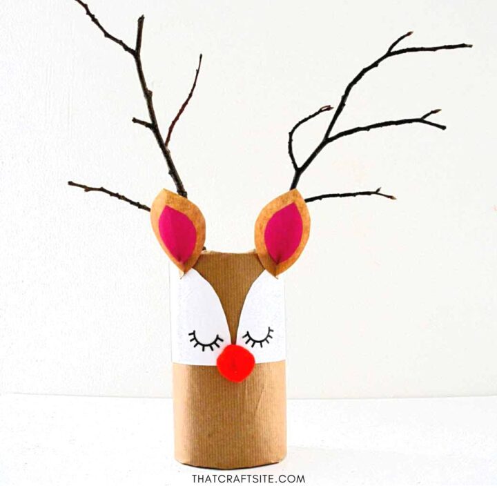 DIY Cylinder Christmas Reindeer Gift Wrap. Step 8: Attache antler twigs to the back of the cylinder.